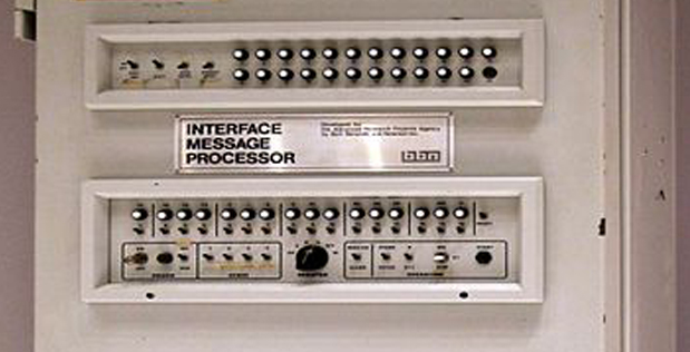 The first ARPANET Interface Message Processor, a tall grey cabinet with a control panel