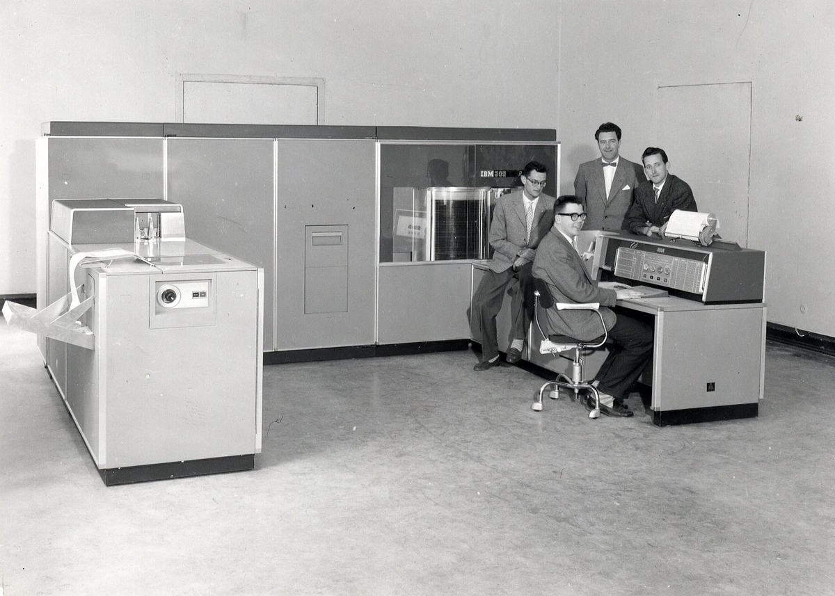 The IBM 305 RAMAC system, a room-sized set of grey cabinets with an operator console