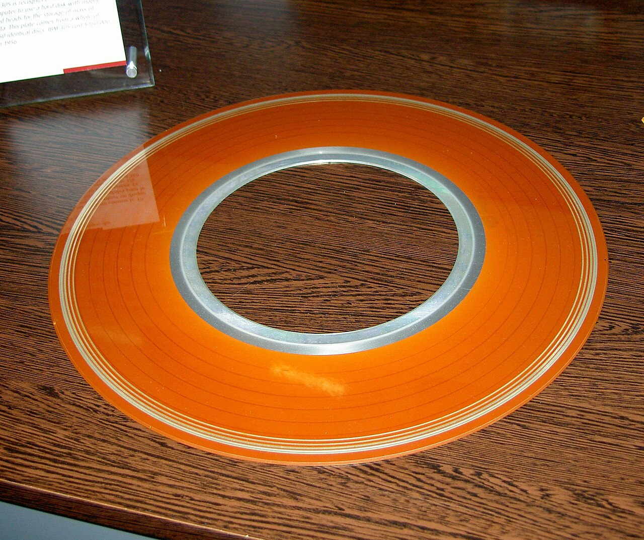 A stack of large 24-inch disk platters from an IBM RAMAC 305 on display in a museum